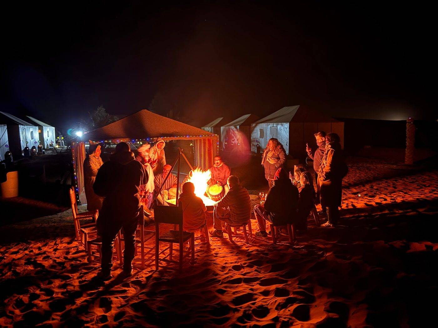 Berber music around the campfire at night, with the tents behind