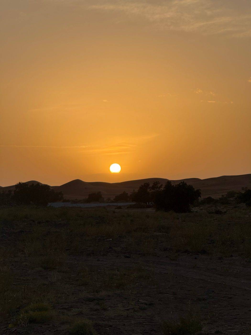 Sunset over the dunes near the camp